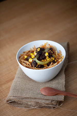 Beef Blackpapper served with rice, corn, onion and spoon on the wooden tableの写真素材