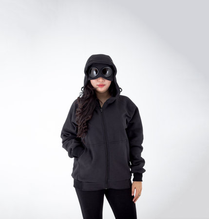 Portrait of a girl in a black hoodie on a white backgroundの写真素材