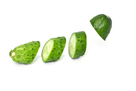 Sliced cucumber isolated on white backgroundの写真素材