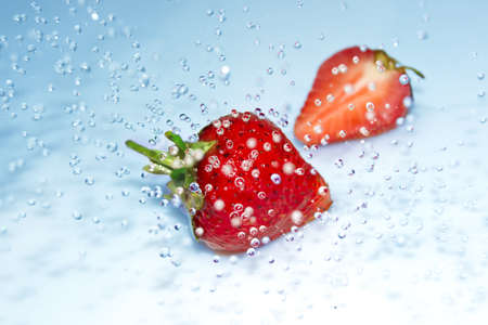 Strawberry in water splashの写真素材