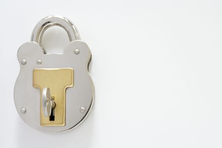 locked padlock with key and room for copy, clipping pathの写真素材