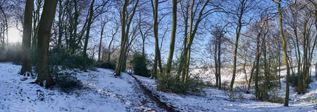 Panoramic photograph of snowy road in the countryside at winter time in The Chilterns,England