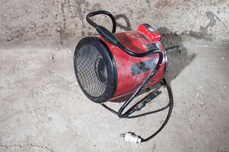Heat gun red on gray concrete background in dirtの写真素材