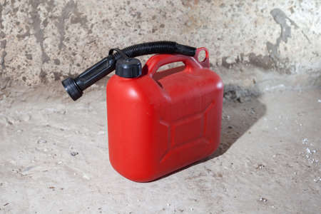 Canister red for combustible lubricants on a concrete backgroundの写真素材