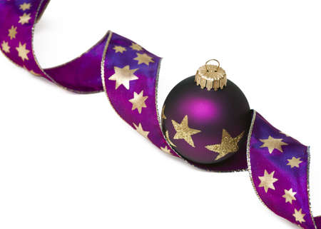 Christmas tree ball with curly ribbon isolated on whiteの写真素材