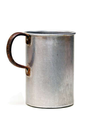 The old aluminium mug, isolated on the white backgroundの写真素材