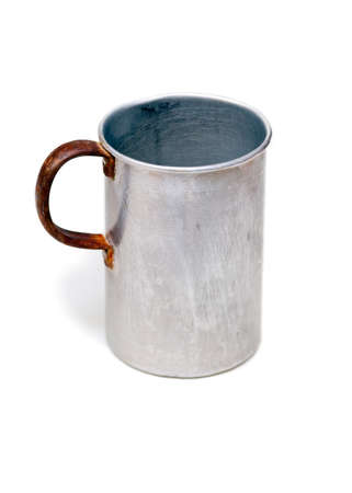 The old aluminium mug, isolated on the white backgroundの写真素材