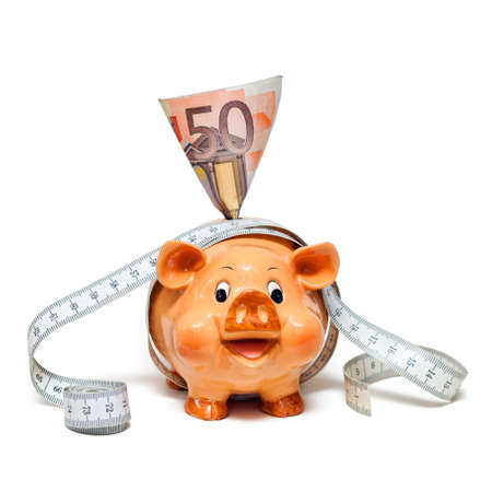 Piggy Bank with 50 Euro note and tape measure の写真素材
