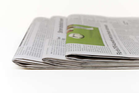 Newspapers isolated on a white background の写真素材