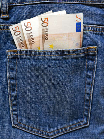  Euro banknotes in the pocket of a blue jeans.の写真素材