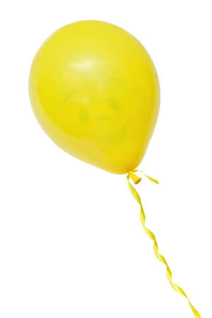 Smiling yellow air flying ball isolated on whiteの写真素材