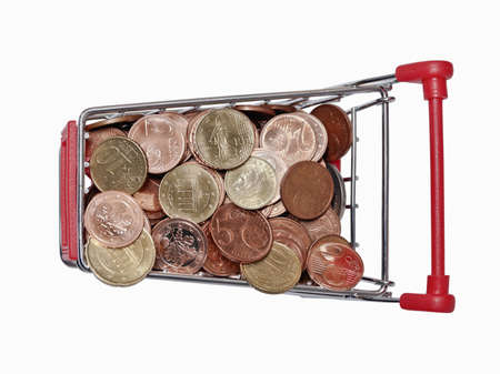 a shopping cart is filled with well-euro coins on white backgroundの写真素材