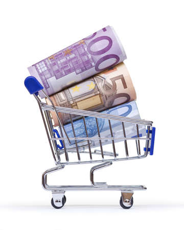 shopping cart with euro banknotes on white background の写真素材