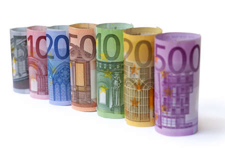 Rolled up Euro bills on white backgroundの写真素材