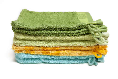 Pile of colorful washcloth over white background の写真素材