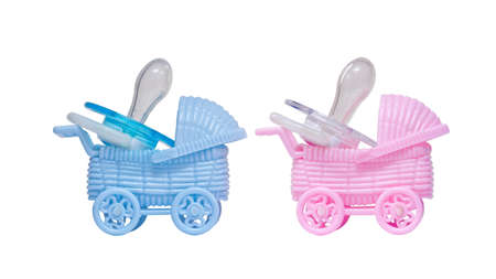 Strollers and pacifiers isolated on white background の写真素材