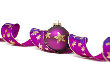 Christmas tree ball with curly ribbon isolated on whiteの写真素材