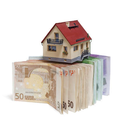 House with Euro banknotes on white backgroundの写真素材