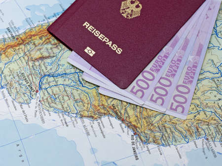 Passport with euro notes on South America Mapの写真素材