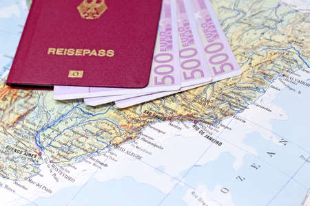 Passport with euro notes on South America Mapの写真素材