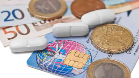 Pills on European currency. Concept of medicating an injured economy, or concept of the cost of medicationの写真素材