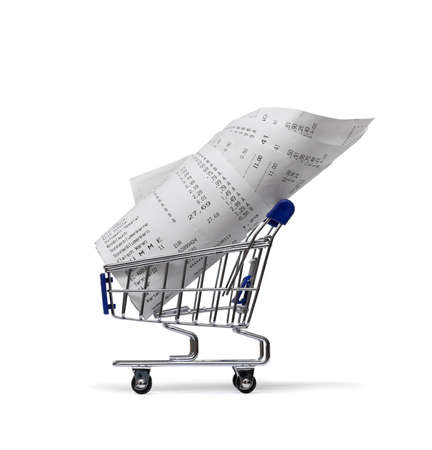 Shopping cart with receipts on whiteの写真素材