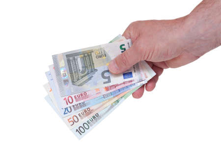Hand holding euro money fan with different billsの写真素材