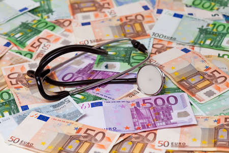 euro banknotes and stethoscopeの写真素材