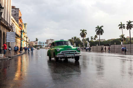 Havana, Cuba 2016.01.22 Retro classic American car drive on the rainy roads round Parc Centrale in Havana, Cuba.のeditorial素材