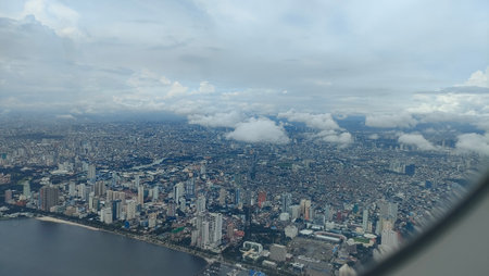 Metro Manila city picturesque views cityscape buildings architecture street trees sky modern ancient...