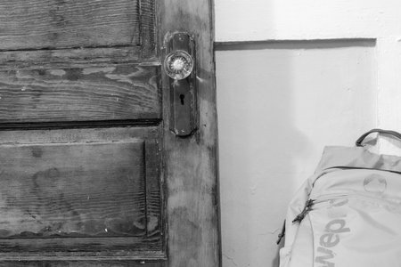 Black and white photo of an old door close up on the handle . High quality photoの写真素材