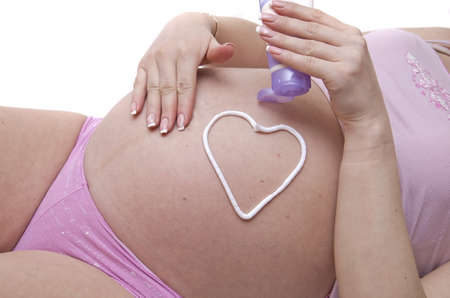 A pregnant woman belly cream smears