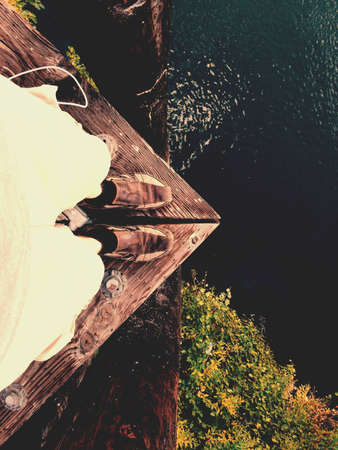 Standing on the edge above the riverの素材