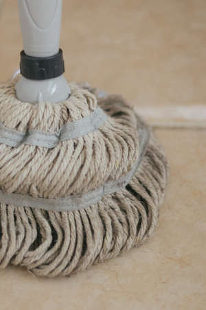 Close up of mop head on tile floorの写真素材