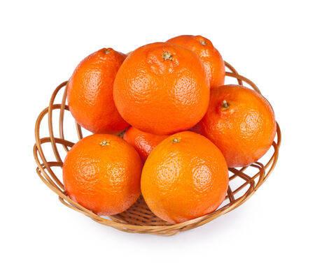 tangerine in basket on white backgroundの写真素材