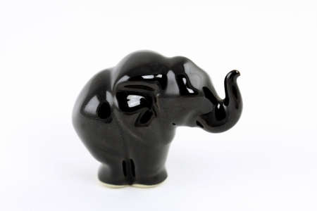 Ceramics black elephant isolated on white backgroundの写真素材