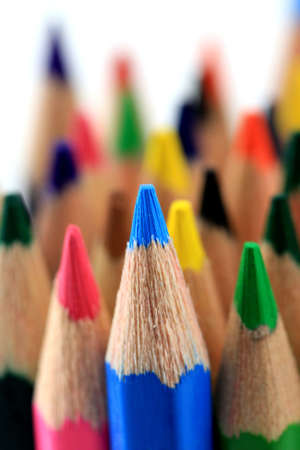 macro shot of colored pencils in a heap; isolated on a white backgroundの写真素材