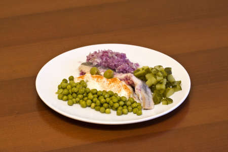 herring in oils with vegetablesの写真素材