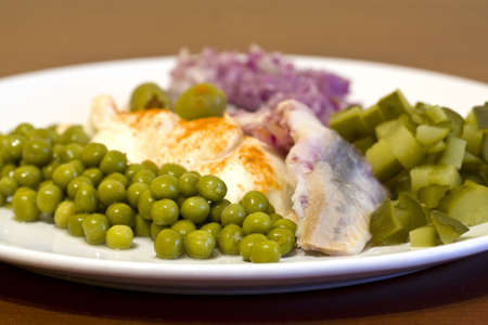 herring in oils with vegetablesの写真素材