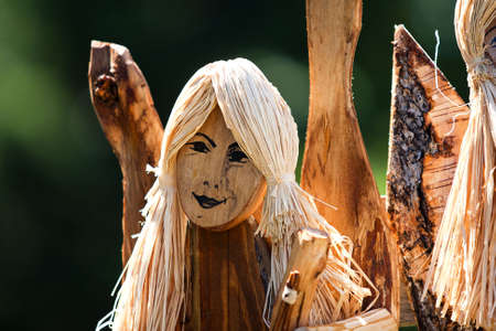 wodden handmade carving of an angel-woman faceの写真素材