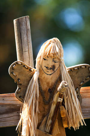wodden handmade carving of an angel-woman faceの写真素材