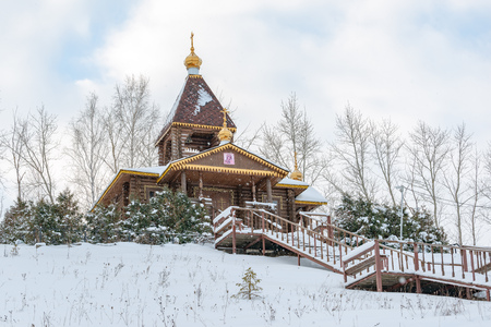 Wooden church in the village. Winter tale and snowy expansesの写真素材