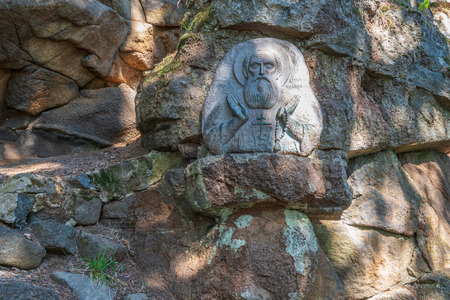 The cell of Alexander Svirsky in the rock of the mountain. The wonderful island Valaam is located on Lake Lodozhskoye, Karelia. Balaam - a step to heavenの写真素材