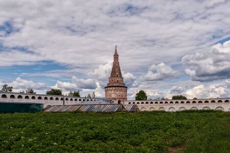Watchtower and potato field. Russian shrines.の写真素材