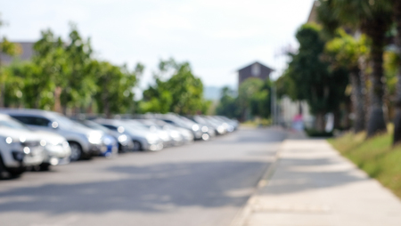 Abstract blurred background of outdoor car park in outlet store with sunlight (defocus)の写真素材