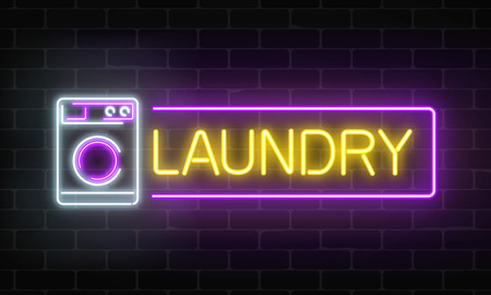 Glowing neon laundry signboard on dark brick wall background. Illuminated self-service wash house sign working round-the-clock. Vector illustration.のイラスト素材