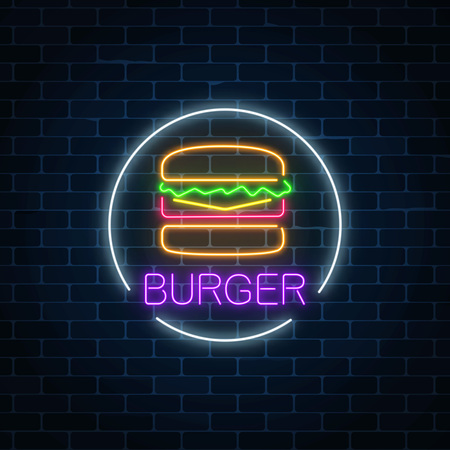 Neon glowing sign of burger in circle frame on a dark brick wall background. Fastfood light billboard symbol. Cafe menu item. Vector illustration.のイラスト素材
