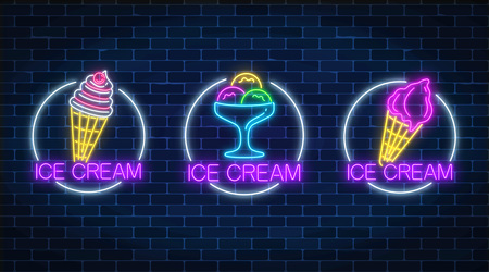 Set of three neon glowing signs of different kinds of ice cream in circle frames on a dark brick wall background. Ice-cream light billboard symbol. Cafe menu item. Vector illustration.のイラスト素材