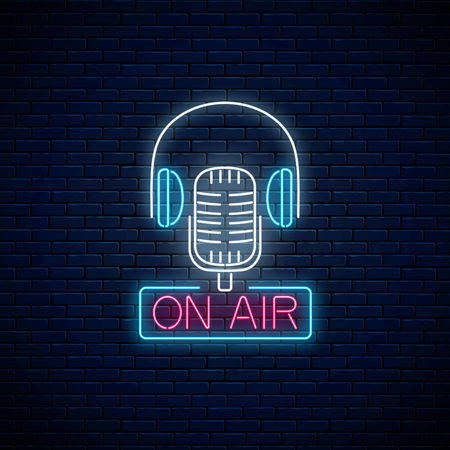 Neon on the air sign with retro microphone and headphones on dark brick wall background. Glowing signboard of radio station. Sound cafe icon. Music show poster. Vector illustration.のイラスト素材