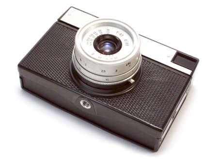 Black photo camera isolated over white background.